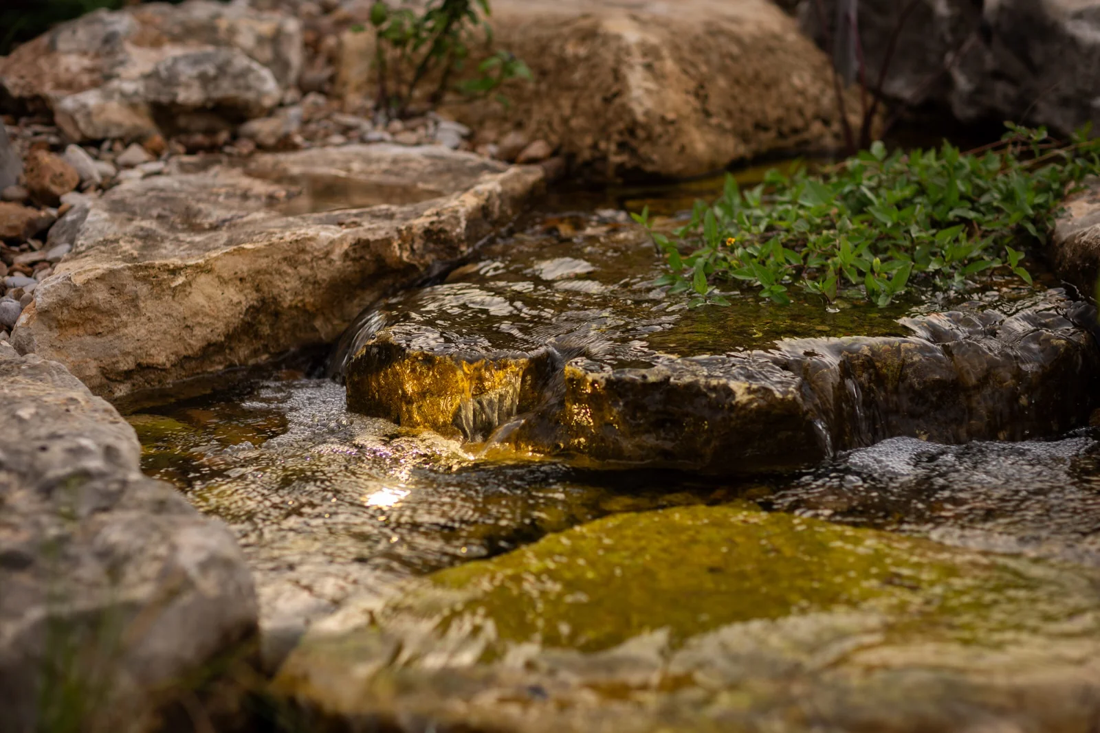 Hand-set stone shaping the course of a stream